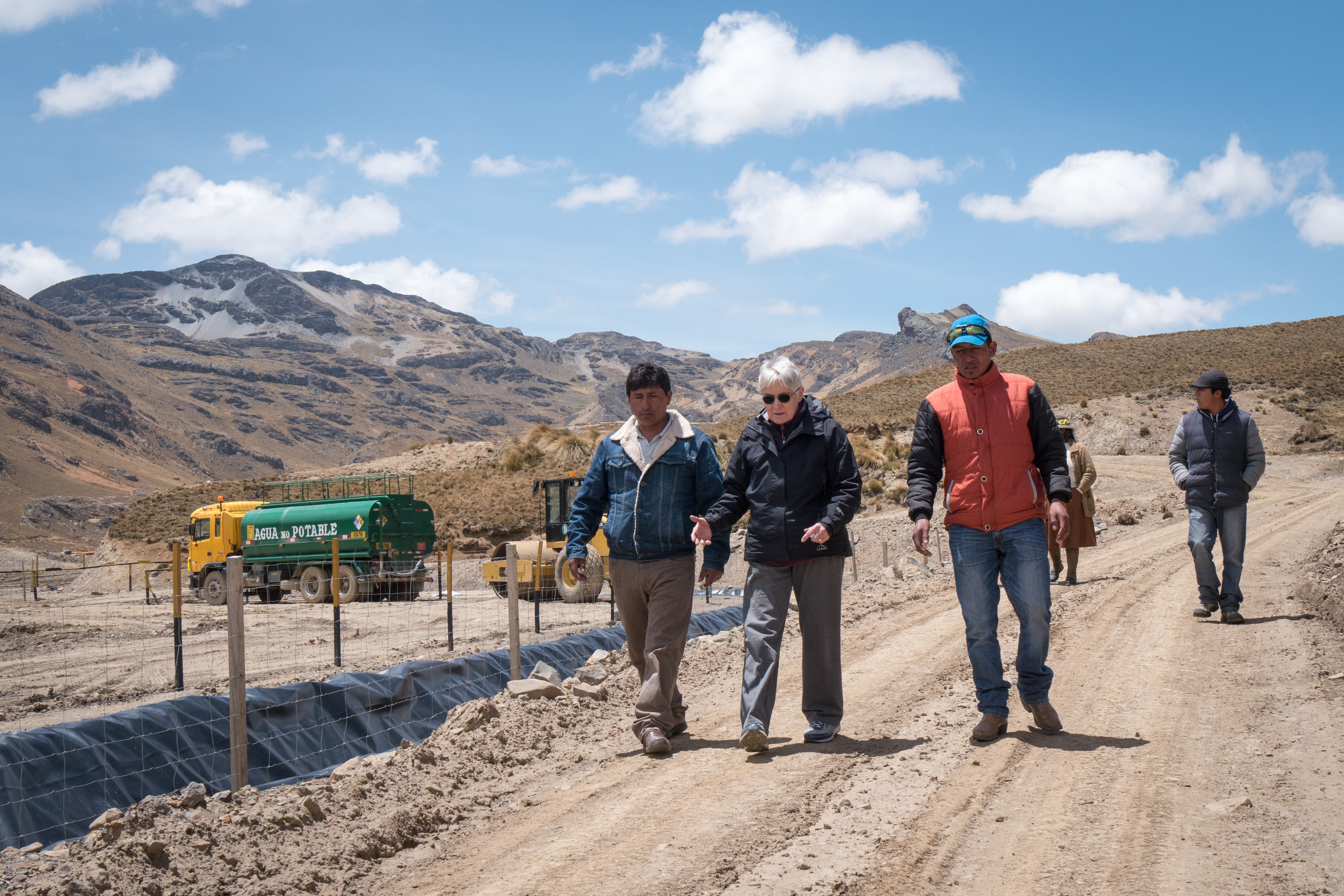 In this 2016 file photo, Maryknoll Sister Pat Ryan walks with members of her environmental team near a contaminated marsh in Condoraque, Peru. Human Rights and Environment, or DHUMA, an organization she helped found, is the recipient of the 2018 Letelier-Moffitt human rights award for its work with indigenous farmers in the Peruvian Andes. (CNS/courtesy Maryknoll Magazine)