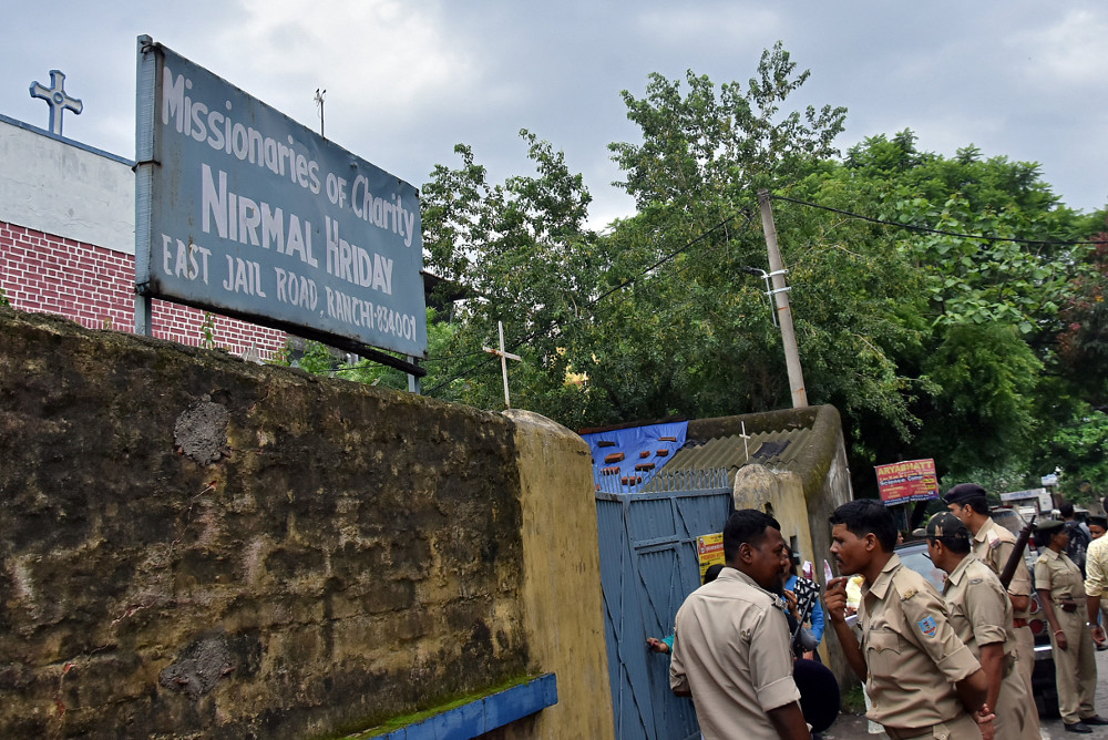 Indian police stand outside the premises of the Missionaries of Charity home in Ranchi, where Sister Concilia was arrested July 5, 2018, on suspicion of child trafficking. (CNS/Reuters)