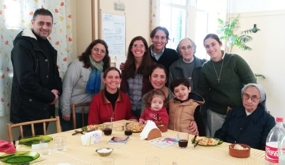 The Ali family poses while dining with the Handmaids of the Sacred Heart. Srs. Marialis Etchegaray and Constanza Di Primio stand in the middle. (Provided photo)