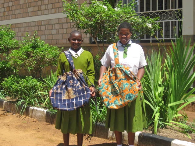 Girls in the program model batik bags they had made. (Stella Storch)