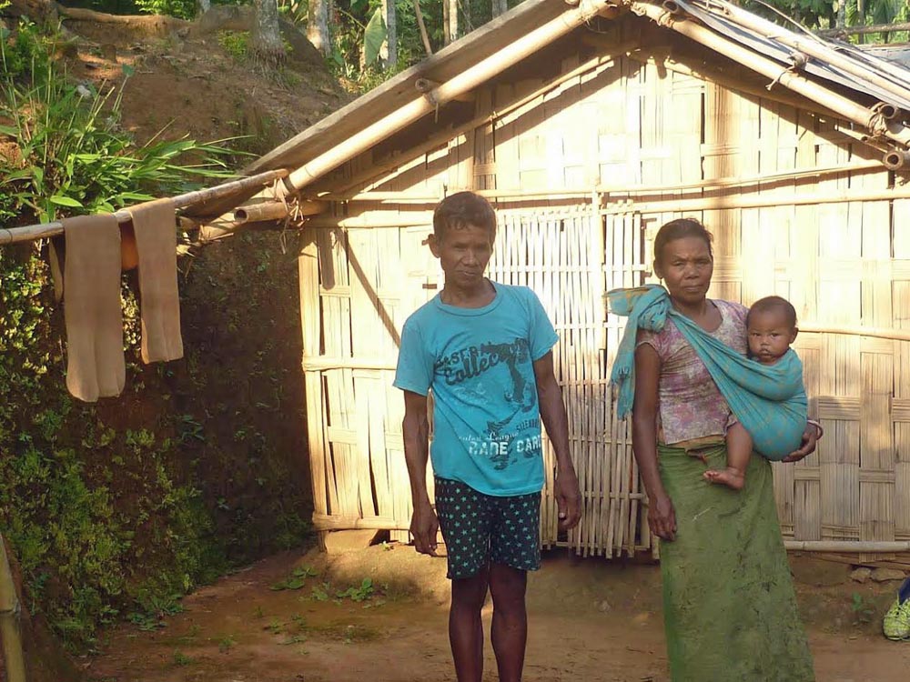 A couple with their child in a village in Tura, Assam (Lissy Maruthanakuzhy)
