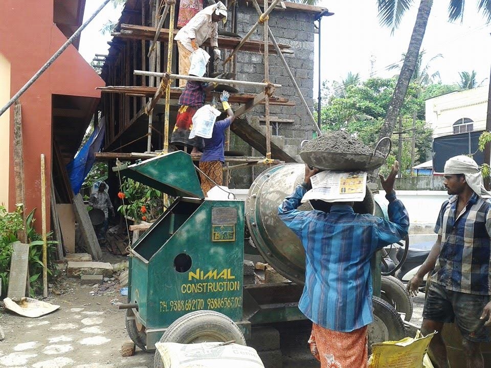 Workers at a house construction site of the House Challenge project. (GSR photo / Philip Mathew)