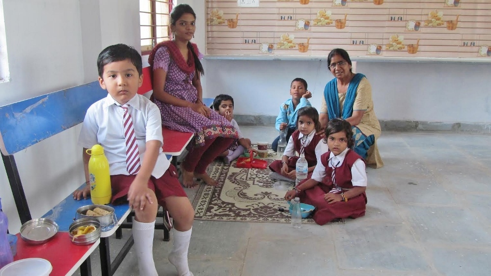 Sr. Pushpanjali Paul visits with some of the children who learn music at a school she has started in Sadhana Sanchar on the outskirts of Bhopal, Madhya Pradesh state, Central India. (Provided photo)