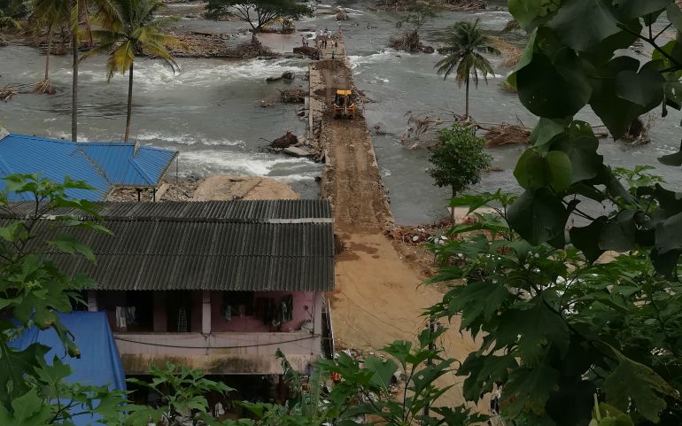 A flood-damaged bridge over the Periyar River at Thadiyampad, in the Idukki District of Kerala is now under repair. (Saji Thomas)