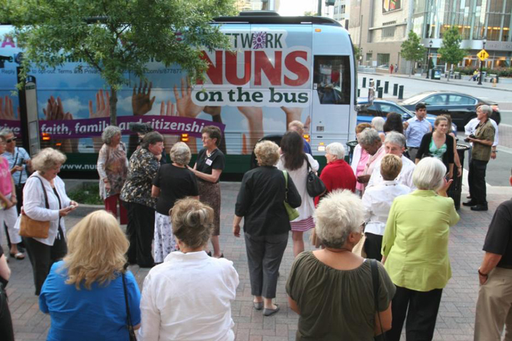 Women religious and their supporters gather in Charlotte, N.C., to greet the Nuns on the Bus in this 2013 photo. The campaign by NETWORD, a Catholic social justice lobby group, began in 2012 to garner political support for solutions to poverty and income inequality and for immigration reform. (CNS/Patricia L. Guilfoyle, Catholic News Herald)