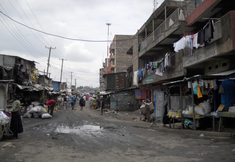 Dirt roads, piles of garbage and open sewers are among the fixtures of everyday life in Kariobangi, a Nairobi slum that's home to half a million people. (CNS file photo 2011 / Patricia Zapor)