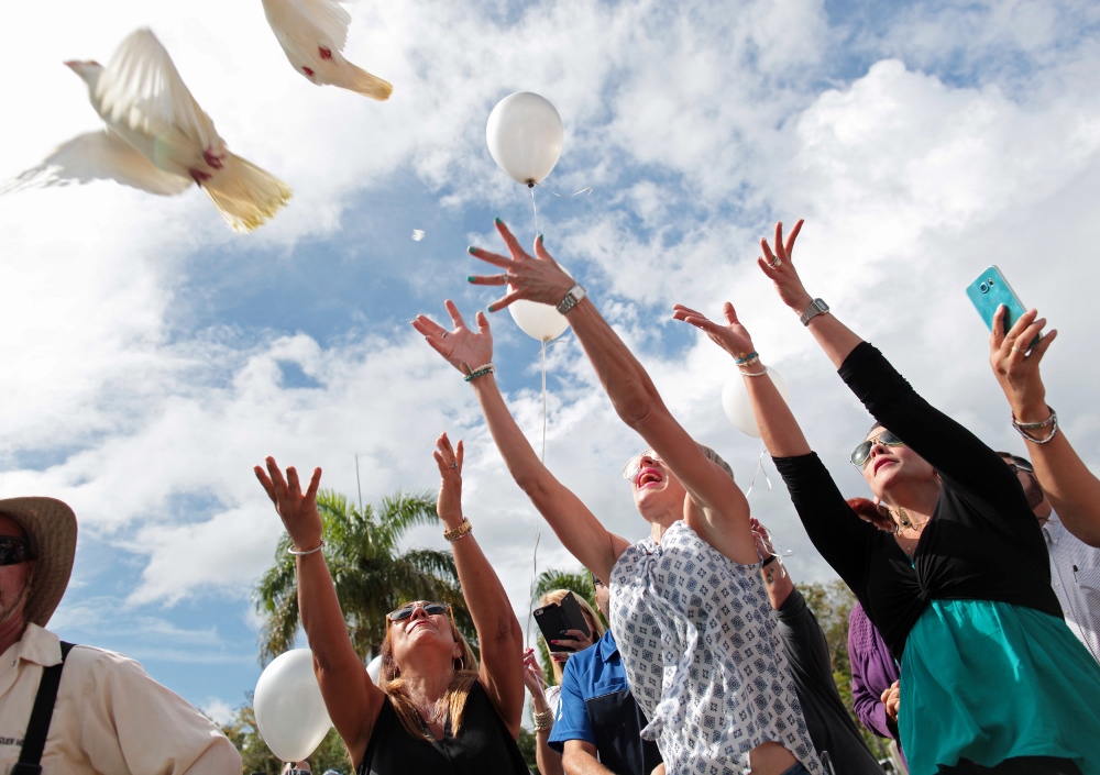 Friends and family release doves and balloons during the June 21 funeral for Franky Jimmy De Jesus Velazquez in his hometown of Caguas, Puerto Rico. He was one of the victims of the June 12 shooting at the Pulse night club in Orlando, Fla. (CNS photo / Alvin Baez, Reuters)