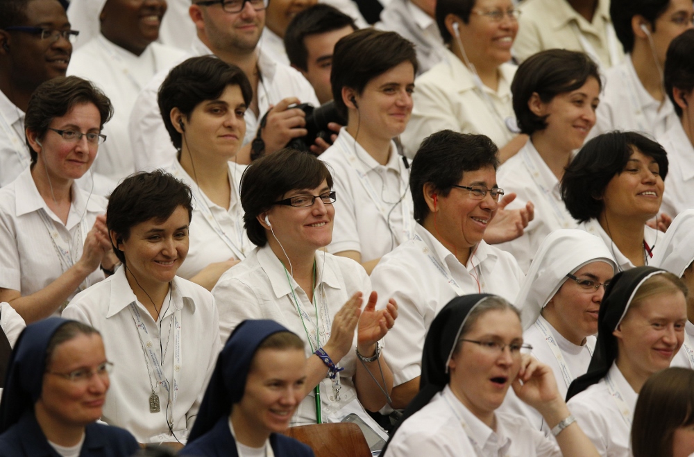 Religious, mainly women, from around the world attend an audience with Pope Francis in Paul VI hall at the Vatican Sept. 17. The pope praised women religious for always heading to the "front lines" to bring the church's tenderness and motherly love to those most in need. (CNS photo / Paul Haring)