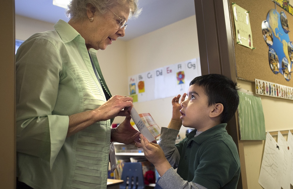 Sr. Joyce Schramm, a Sister of the Most Precious Blood, works with Holy Trinity Catholic School kindergarten student William Nieto, who participates in the English as a Second Language program at Holy Trinity school. (CNS photo/Sid Hastings, St. Louis Review)