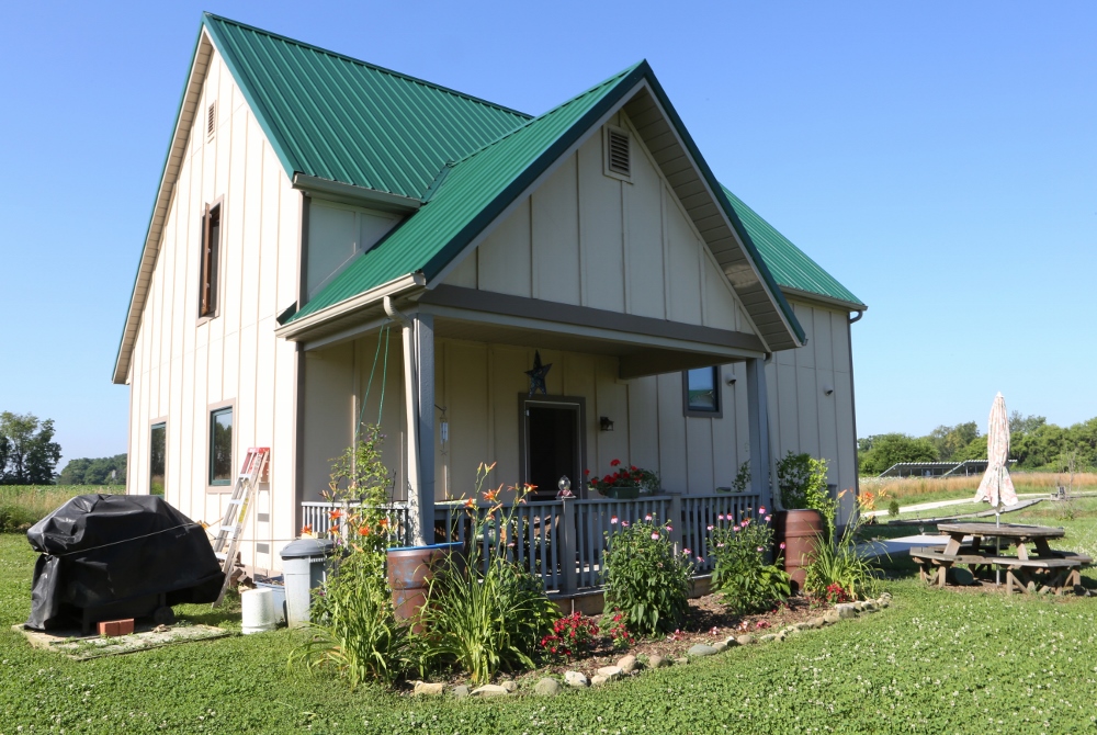 Comfortable and sturdy: An energy-efficient straw-bale house is shown on the grounds of the Sisters of St. Francis of Tiffin, Ohio, in July. (CNS photo/Chaz Muth)
