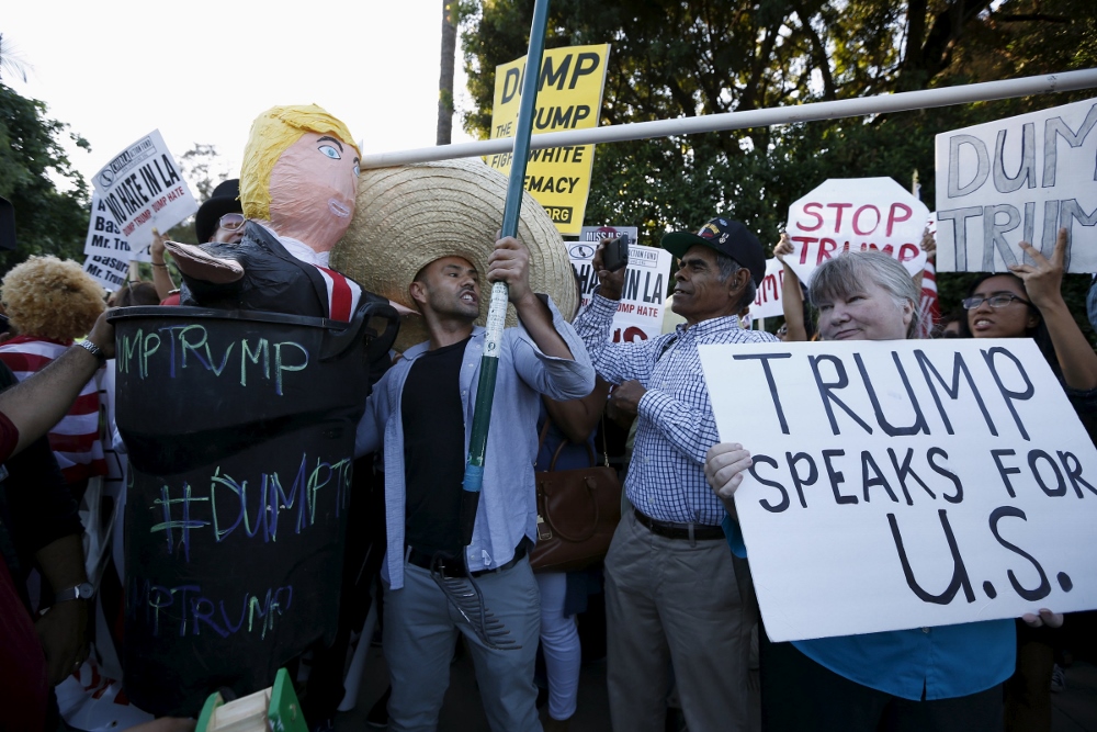 Opponents and supporters of Republican presidential candidate Donald Trump demonstrate outside a Los Angeles hotel July 10. (CNS photo / Lucy Nicholson, Reuters)