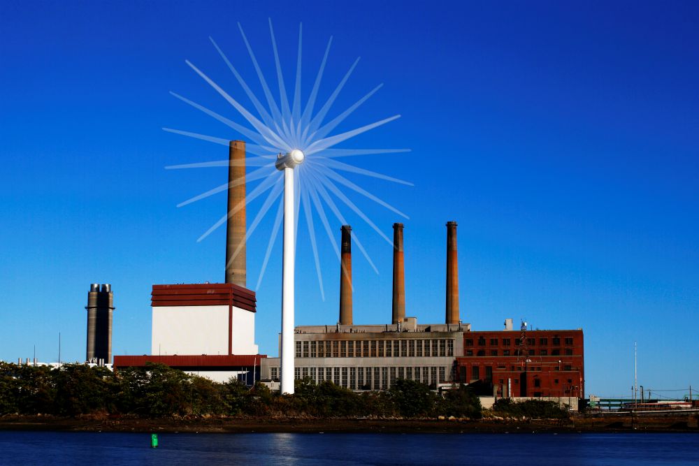 A wind turbine turns in front of a fossil fuel power plant in Charlestown, Massachusetts, in 2013. (CNS/Reuters/Brian Snyder)