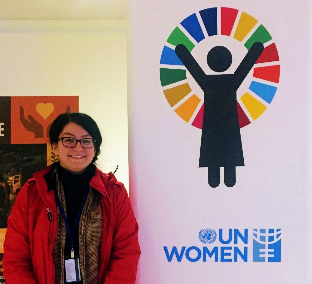 Viviana Garcia-Blanco stands by a sign for U.N. Women, the United Nations' entity that works for gender equality and rights for women. (Provided photo)