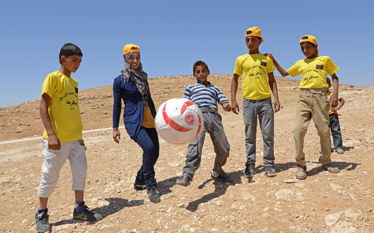 Youths from the South Hebron Hills kick around a soccer ball June 28 at summer camp in the West Bank village of Tuba. (CNS/Debbie Hill) 
