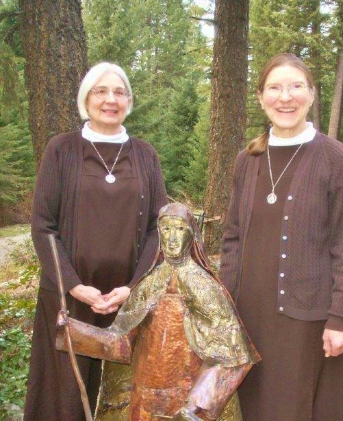 Carmelite Sisters of Mary Leslie Lund and Nancy Casale pose by a statue of St. Teresa of Avila. (Provided photo)