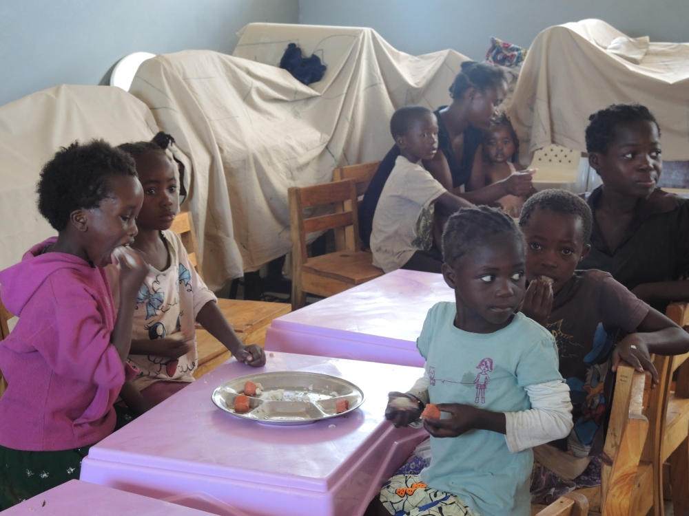 Children in Chililabombwe at the daily feeding program run by the Franciscan sisters. The sisters provide up to 2,000 meals per week. (Melanie Lidman)