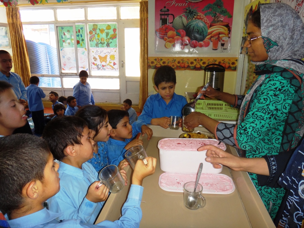Sr. Razia starts serving ice cream to the children at snack time. (Provided photo) Sister Razia serves ice cream to the children at snack time at Pro Bambini di Kabul, a school for children with disabilities in Kabul, Afghanistan, in 2015.