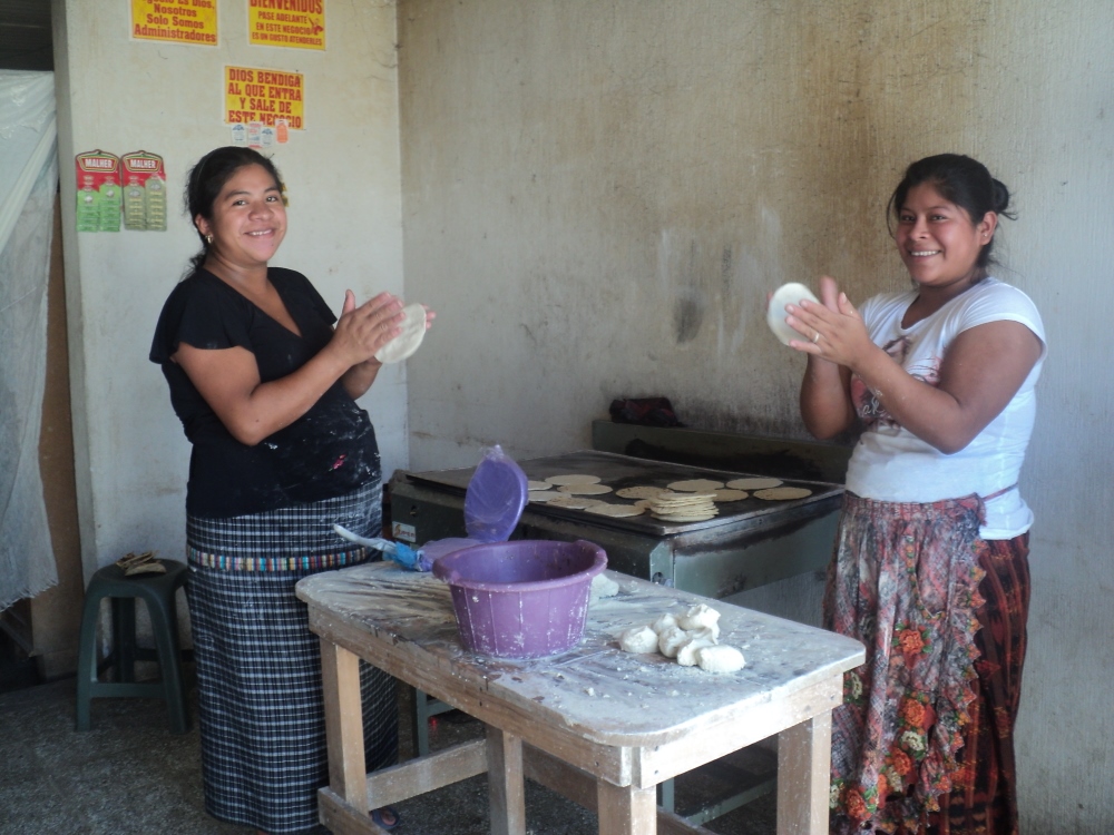 These two women on Sr. Sarah's street make and sell corn tortillas out of their home. Corn is the center of the Guatemalan diet. (Tracy Kemme)