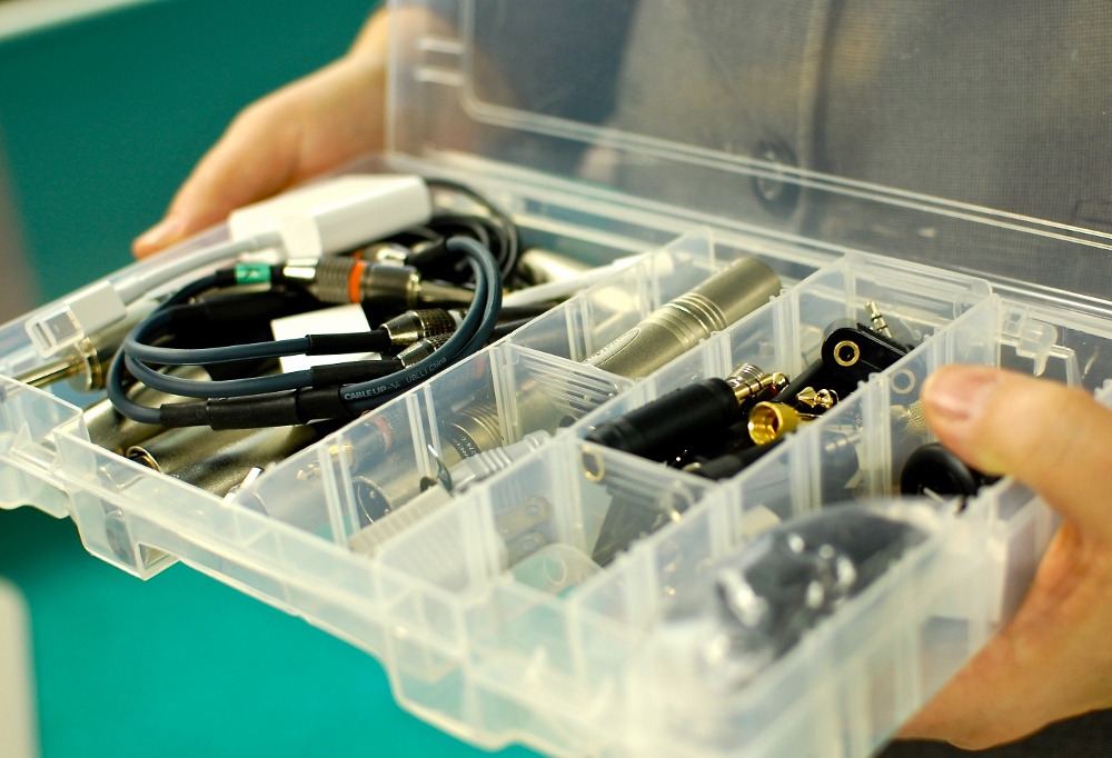Immaculate Heart of Mary Sr. Julie Vieira shows off a box of spare plugs and adapters. When A Nun's Life Ministry began the Motherhouse Road Trip, they learned quickly to be prepared for anything. (Dan Stockman)