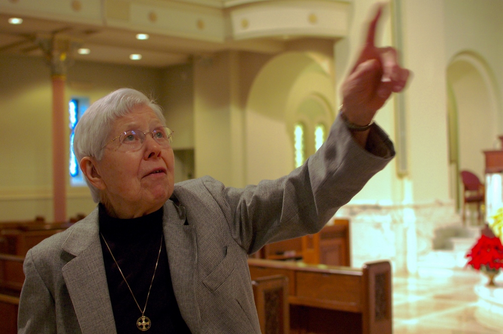 Benedictine Sr. Mary Carmel Spayd points to the dome in the church at Immaculate Conception Monastery in Ferdinand, Indiana. Spayd, 90, and her twin sister, Benedictine Sr. Mary Carmen Spayd, have climbed to the top of the dome to look around. (GSR photo / Dan Stockman)