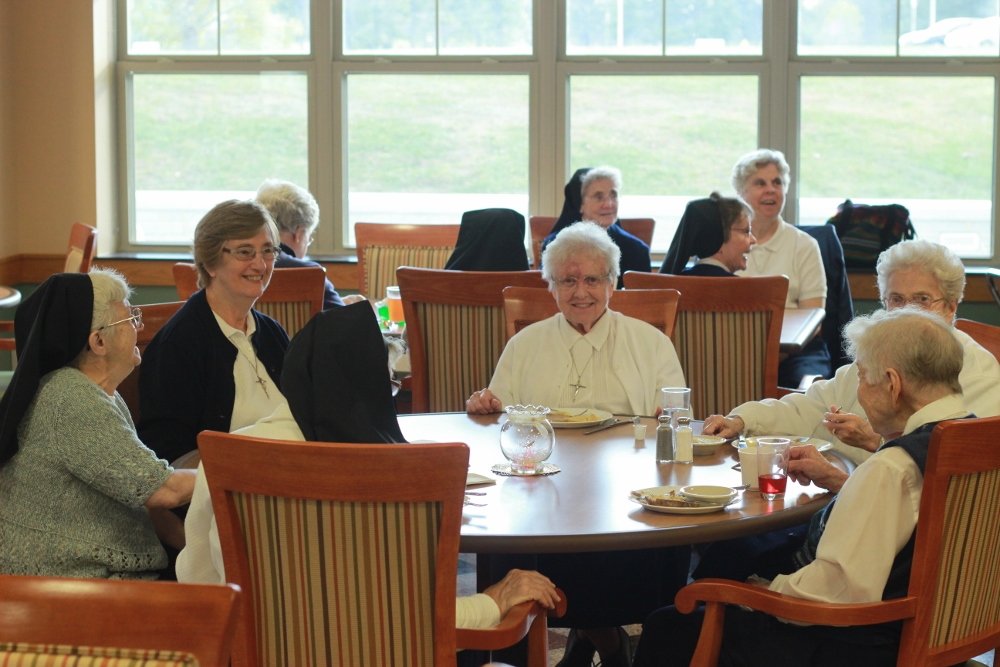 Sisters, Servants of the Immaculate Heart of Mary enjoy dinner together in a family-style setting at Camilla Hall. (Colin Evans)