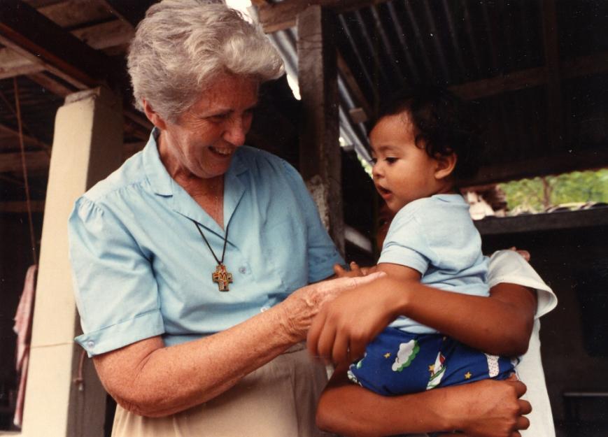 Sr. Madeline Dorsey with a child in El Salvador in the late 1970s. (Used with permission of Maryknoll Sisters)