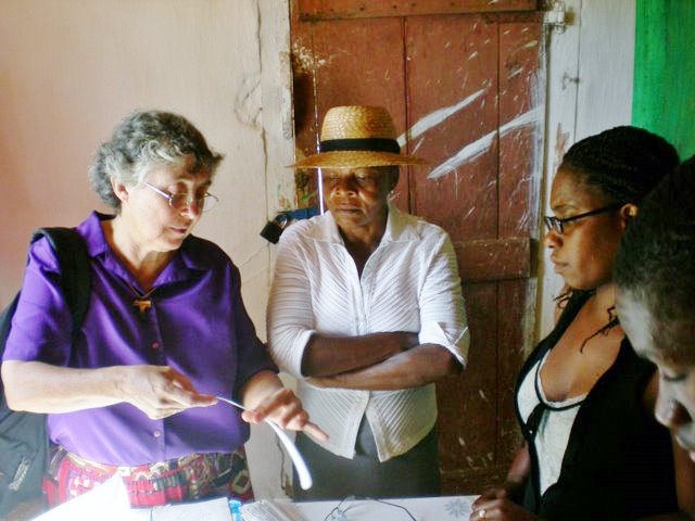 Sr. Fidelis Rubbo shows villagers how to use the medical records monitoring system.