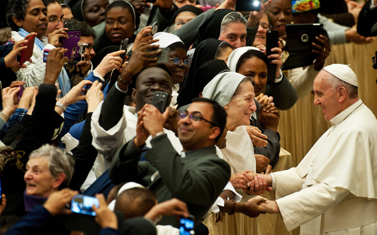 Pope Francis greets nuns and priests Saturday during a meeting with participants in an international congress organized by the Congregation for Institutes of Consecrated Life and Societies of Apostolic Life in Paul VI hall at the Vatican. (CNS / Catholic Press Photo / Massimiliano Migliorato)