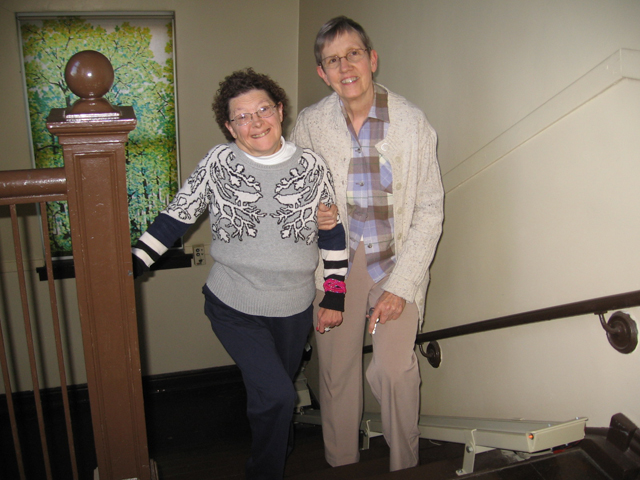 Providence Sr. Susanne Gallagher, right, and her sister Rita, who has Down syndrome, on their way to meet Rita's SPRED group friends