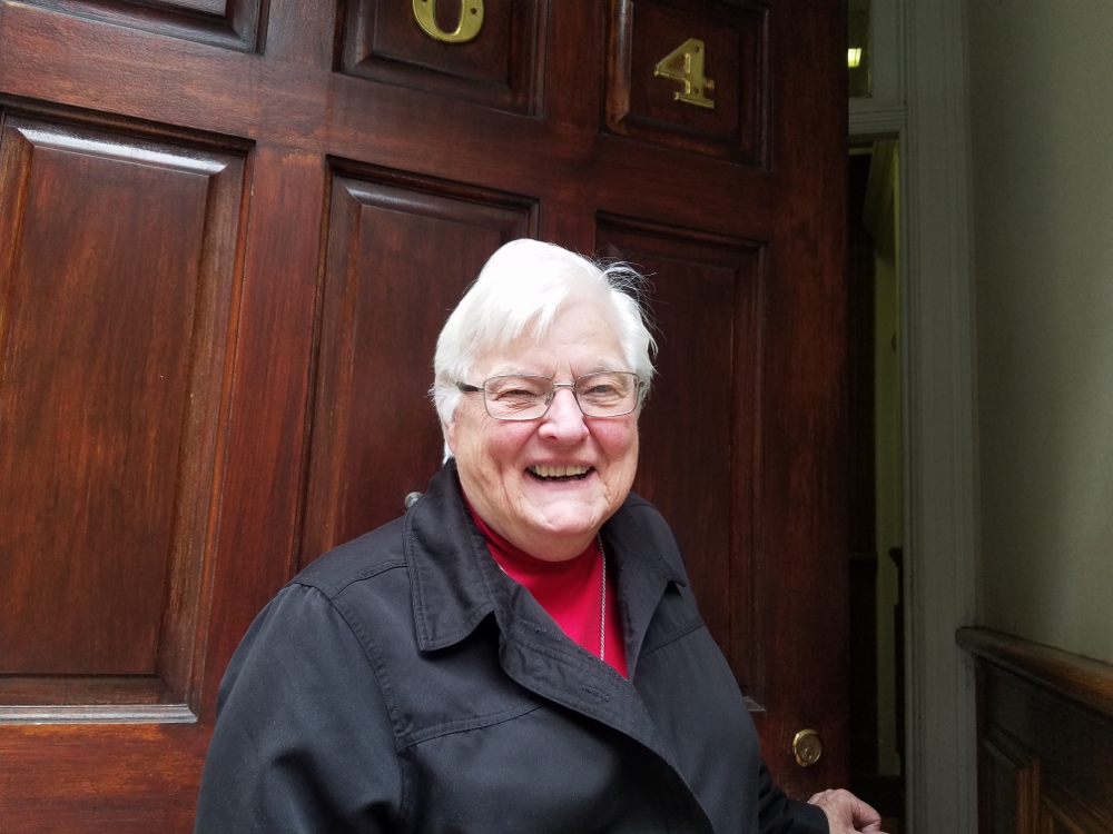 Sr. Mary Petrosky of the Franciscan Missionaries of Mary smiles outside the door of the Holy Name of Jesus Convent in Upper Manhattan. (GSR photo / Chris Herlinger)