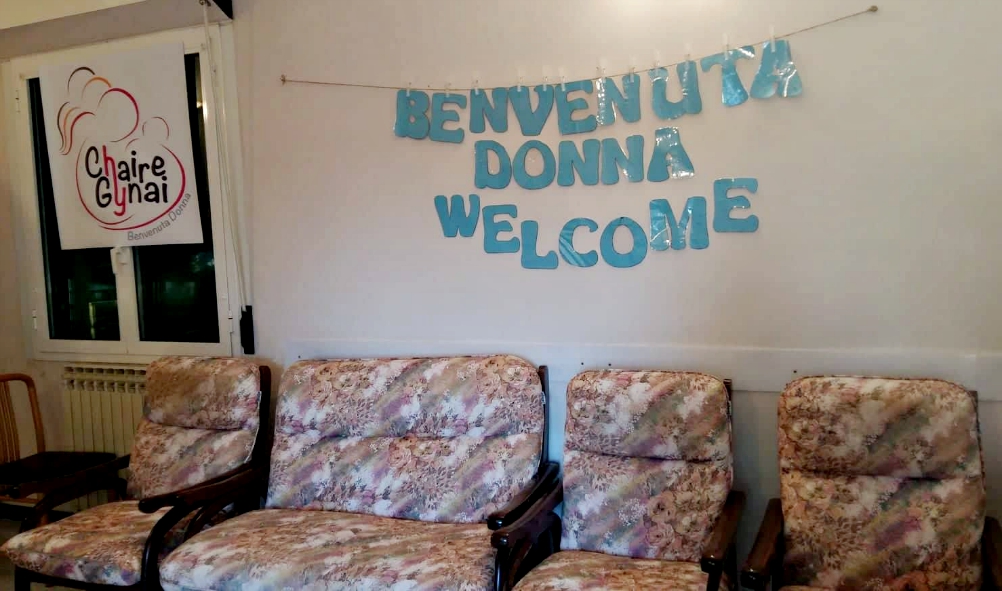 A welcome sign hangs in the living room of the house for migrant women and their children on Via Pineta Sacchetti in Rome, one of two houses that are part of Chaire Gynai. (Philippa Hitchen)