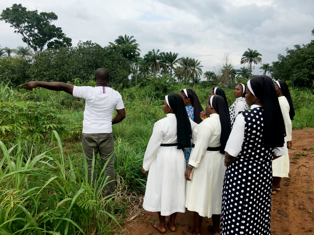 The site contractor gives details related to the Augustinian nuns' future convent and chapel. (Festus Iyorah)