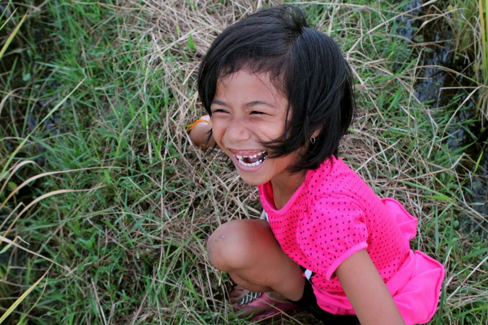 One of the girls I live with, Nonnie, playing in the rice field next to our house. (Bridgid O’Brien)
