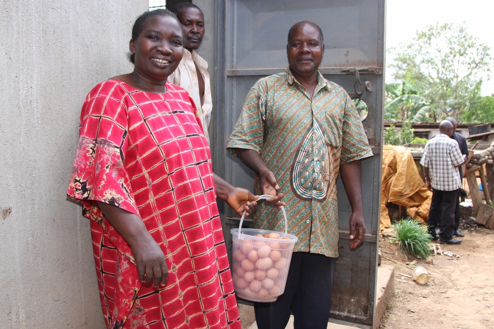 Peter and Josephine collecting eggs from the chickens. (Caroljean Willie)