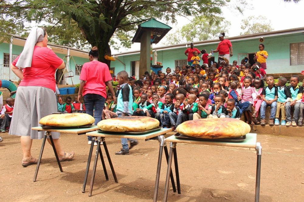 Bread for children at one of the Salesian fun activity days. (Christian E. Ruehling)