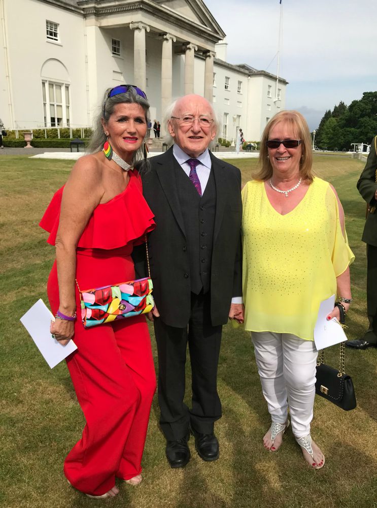 Gabrielle O'Gorman, left, stands with Ireland's President Michael D. Higgins at Áras an Uachtarán at a garden party to honor the 220 Magdalene survivors on June 5. (Courtesy of Gabrielle O'Gorman)