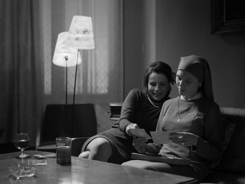 Wanda, Ida’s aunt, played by Agata Kulesza, and Ida/Anna, played by Agata Trzebuchowska, reminisce in a scene from “Ida.” (Courtesy of Music Box Films)