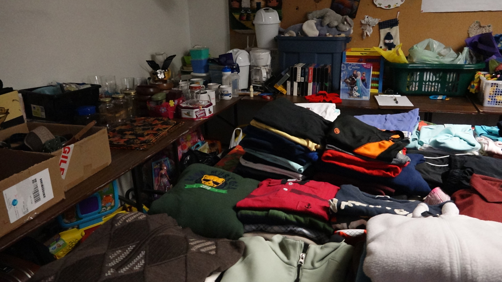 Donations wait at the Becoming Neighbours office for new Canadians who need clothes, toys and other items for their families. (Dana Wachter)