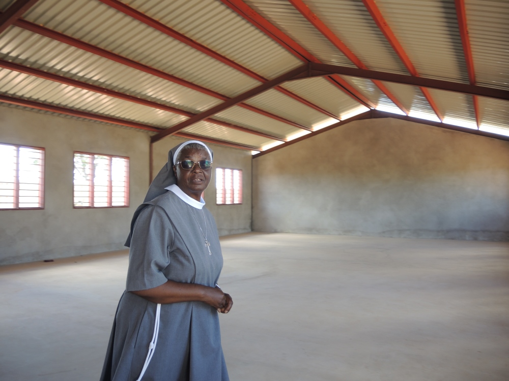 Sr. Josephine Mulenga stands in the Mt Purpose Skills Workshop in March, which will eventually house metal working and carpentry training programs. (Melanie Lidman)