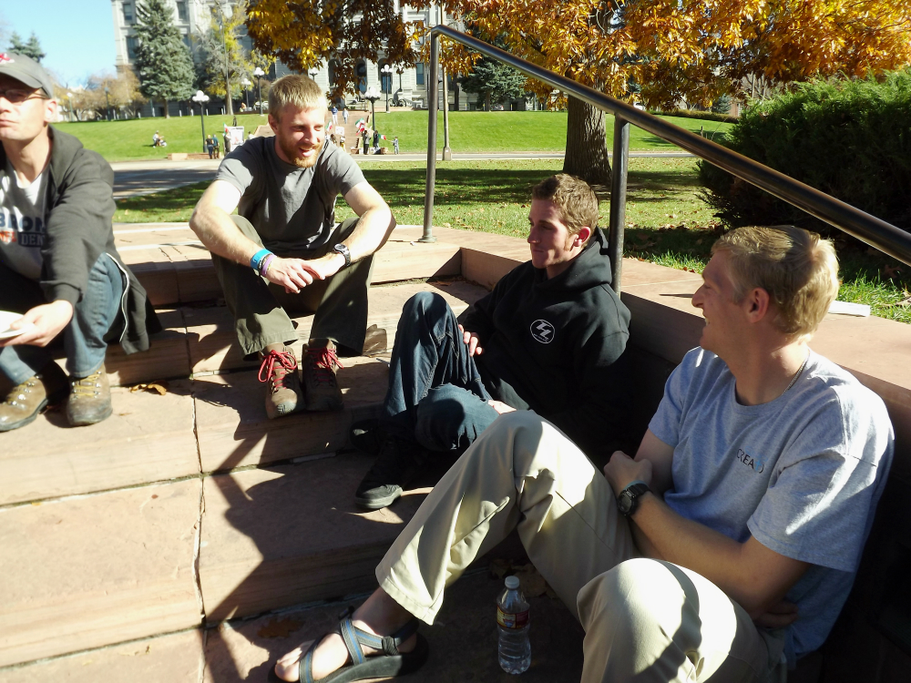 Codi Kruger, second from left, chats with a “friend from the street" during a Lunch in the Park event in November 2014. The event is hosted by Christ in the City volunteers who seek to build relationships with the homeless population in Denver. (Provided photo)