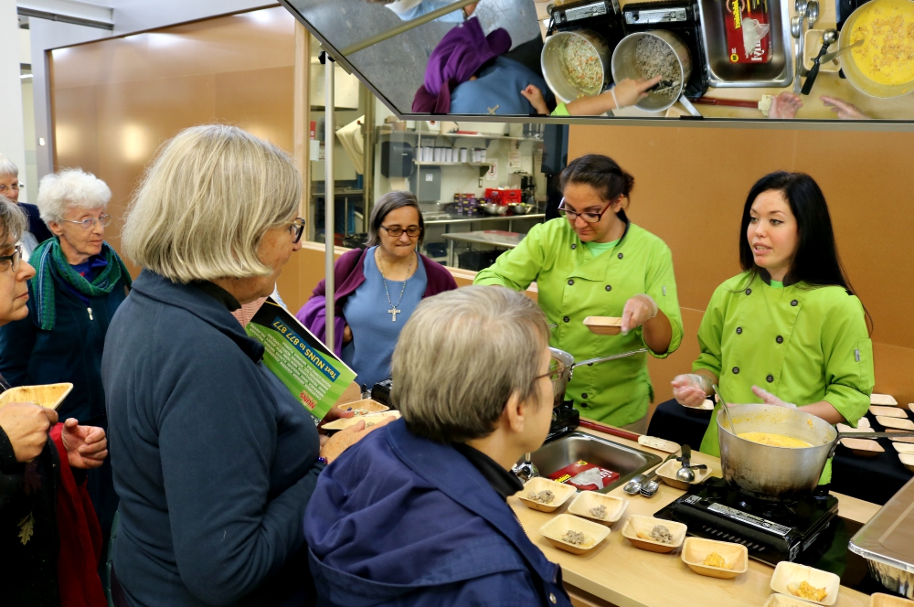 The Nuns on the Bus talk with members of the Lutheran Metropolitan Ministry's Chopping for Change program Oct. 20 in Cleveland. (Network Lobby for Catholic Social Justice / Colleen Ross)