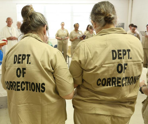 Carol Elizabeth Lovingood, left, and Carla Rae Hopwood at a June 2014 Mass at Lee Arrendale State Prison in Alto, Georgia. (CNS / Georgia Bulletin / Michael Alexander)