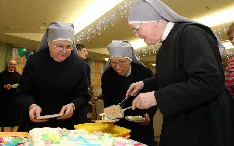 Little Sisters of the Poor prepare to distribute cake during a birthday party for centenarians Jan. 20 at the sisters' Queen of Peace Residence in the Queens borough of New York. (CNS photo / Gregory A. Shemitz)