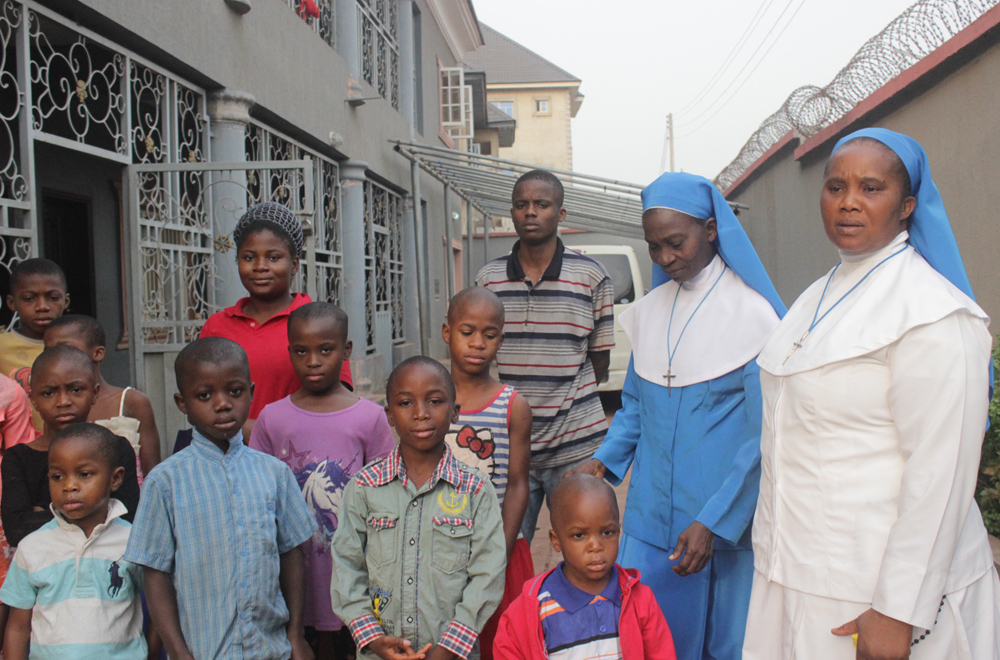 "It is a thing of joy, living with the children here," says Sr. Eucharia Chukwueke, right, director of the home. With her is Sr. Elizabeth Nwankwo, second from right. (Patrick Egwu) 