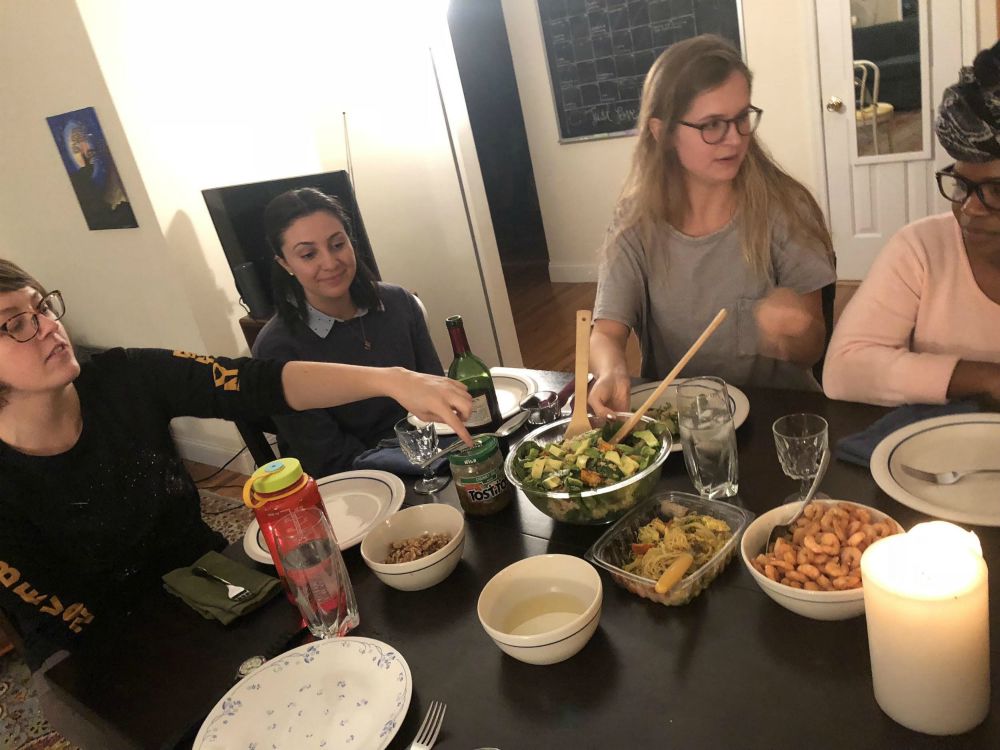 My community sharing a meal together as we discuss what simplicity means to us (Sarabella Muise)