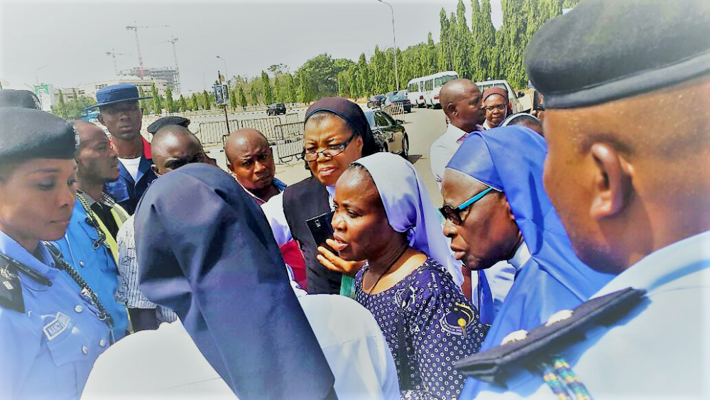 Police block the sisters from entering the National Assembly on Nov. 24 in Abuja, Nigeria. (Provided photo)