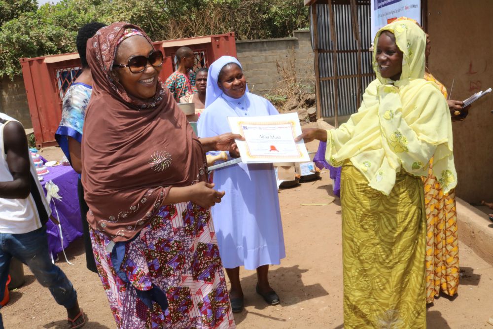 One of the participants receives her certificate after the two-week empowerment program. (Courtesy of Sr. Agatha Chikelue)