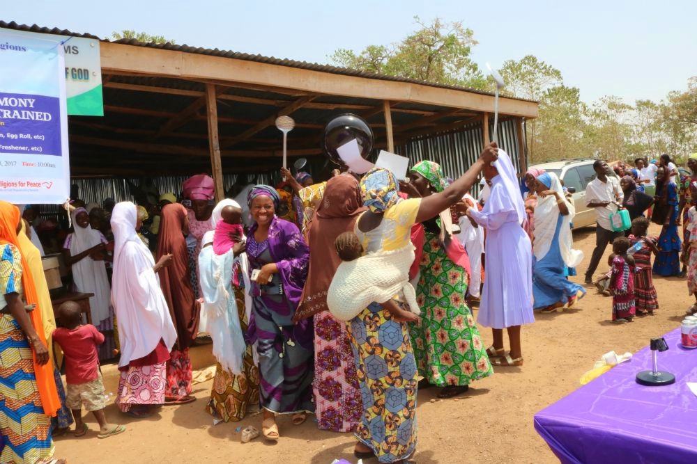 The women celebrate after receiving catering equipment from the network. (Courtesy of Sr. Agatha Chikelue)