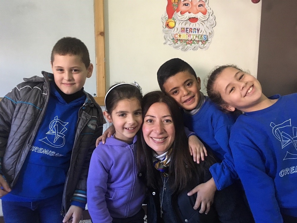 Natalia Liviero poses with second-grade students. (Provided photo)