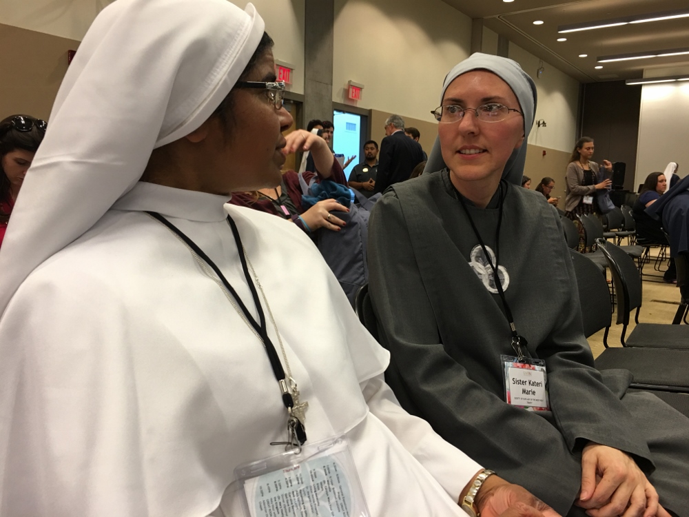 Franciscan Sister of the Immaculate Heart of Mary Merrita Mary, left, and Sister of Our Lady of the Most Holy Trinity Kateri Marie talk before a GIVEN session. (GSR photo / Dawn Araujo-Hawkins)